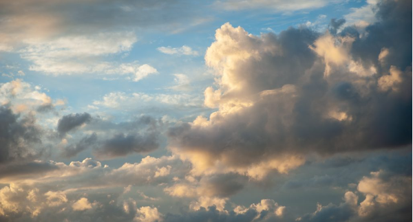 Clouds on a summer's day, lit up by the setting sun