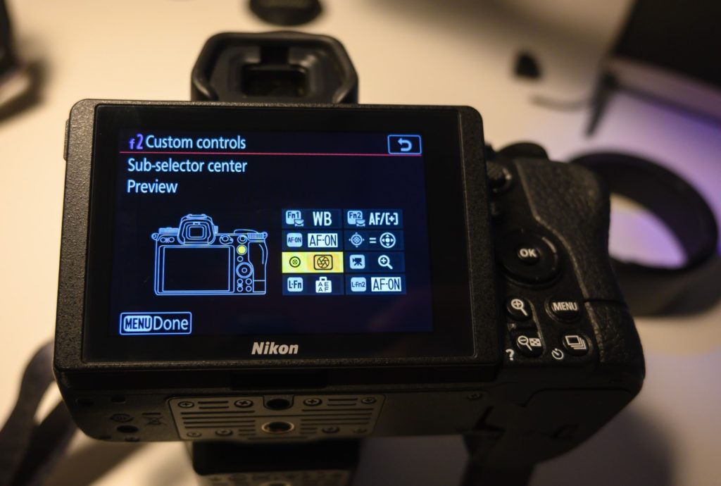 The role of the preview button on a camera.